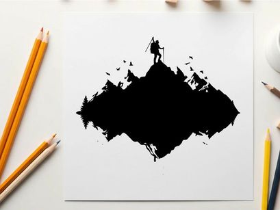 Silhouette of a hiker on a mountain peak at sunset