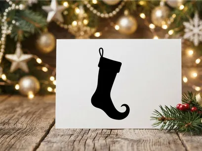 Black silhouette of a Christmas elf stocking isolated on a white background