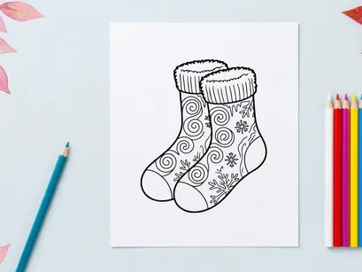 Pair of festive Christmas socks with snowflake and swirl patterns for holiday celebrations