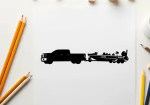 Silhouette of a pickup truck towing a fishing boat