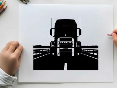 Silhouette of a mack truck on a bridge