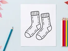 Pair of cozy winter socks line art illustration for Christmas holiday design projects.