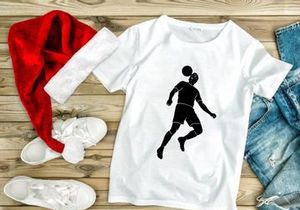 Silhouette of a soccer player kicking a ball in mid air motion