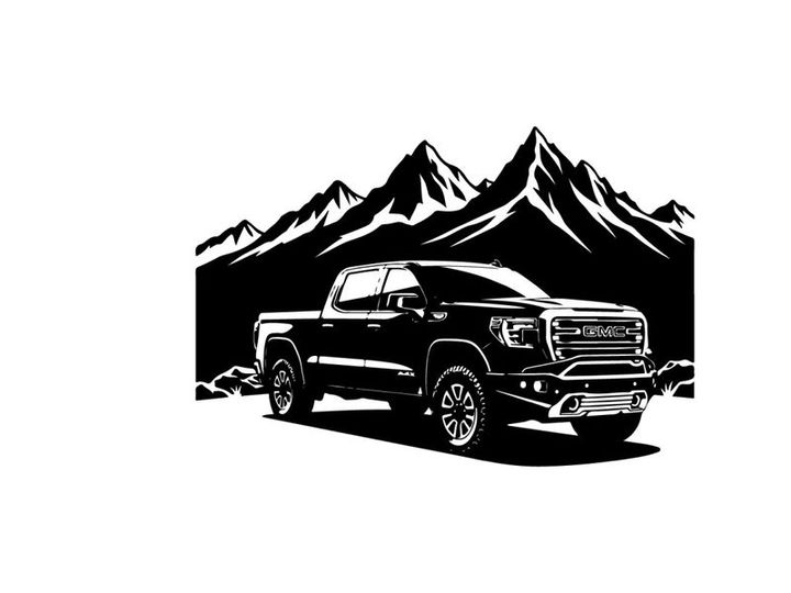 Silhouette of a pickup truck in front of mountains