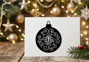 Black and white Christmas bauble ornament with elegant floral swirl pattern design