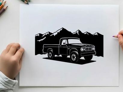 Silhouette of a pickup truck in front of mountains