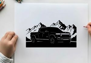 Silhouette of a pickup truck in front of majestic mountain range silhouette