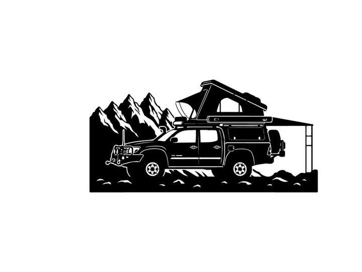 Silhouette of a car with a rooftop tent in a mountainous landscape silhouette