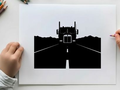 Silhouette of a semi truck driving on a deserted highway at night