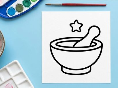 Mortar and pestle with golden star for spice grinding. Traditional kitchen tool used in herbal medicine and gourmet cooking preparation.