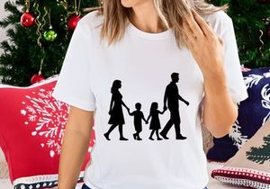 Happy family walking together holding hands silhouette outdoor
