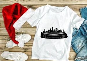 Black and white illustration of a city skyline with a large stadium