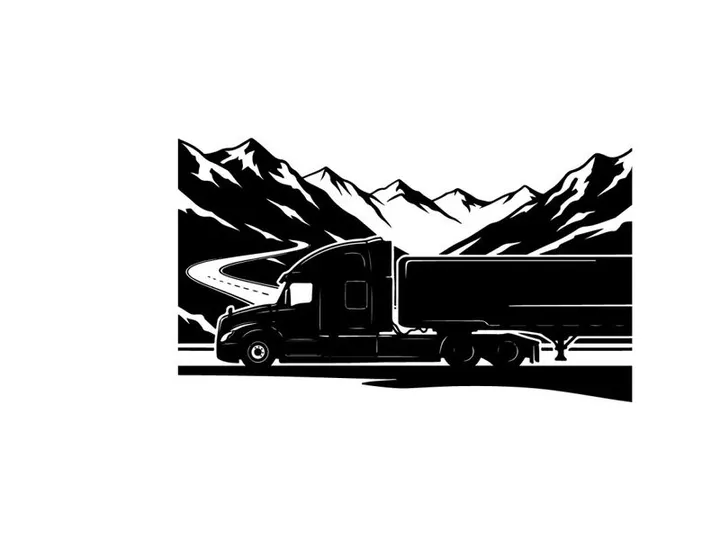 Truck silhouette driving through mountains