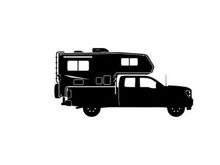 Silhouette of a pickup truck with camper