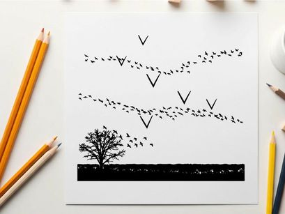 Silhouette of birds flying over a tree at sunset