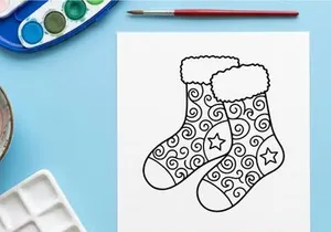 Hand-drawn Christmas socks with stars and swirls for festive holiday decor and gifts