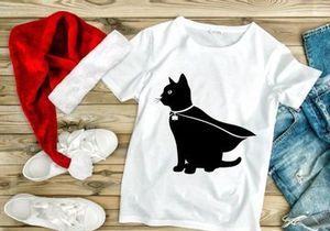 Black cat in cape and shamrock charm