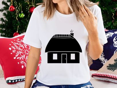 Thatched roof cottage with smoking chimney