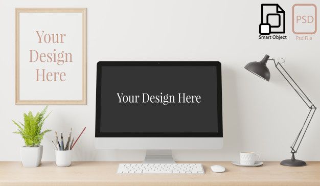 Frame and computer screen mockup  on working desk interior