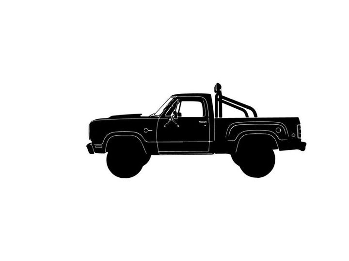 Silhouette of a classic pickup truck with large tires and roll bar silhouette