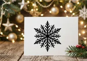Black snowflake icon isolated on white background for winter holiday design elements.