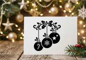 Christmas ornament decoration with holly and hanging baubles