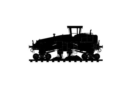 Silhouette of a large industrial train engine on railroad tracks
