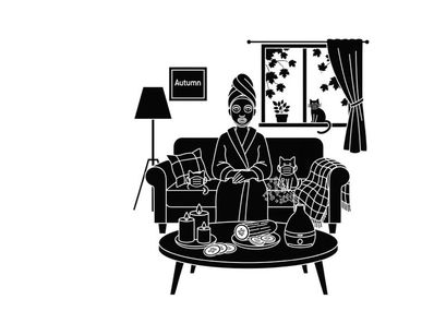 Silhouette of a woman relaxing at home with a cat