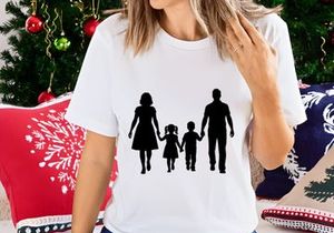 Happy family holding hands walking together silhouette outdoor