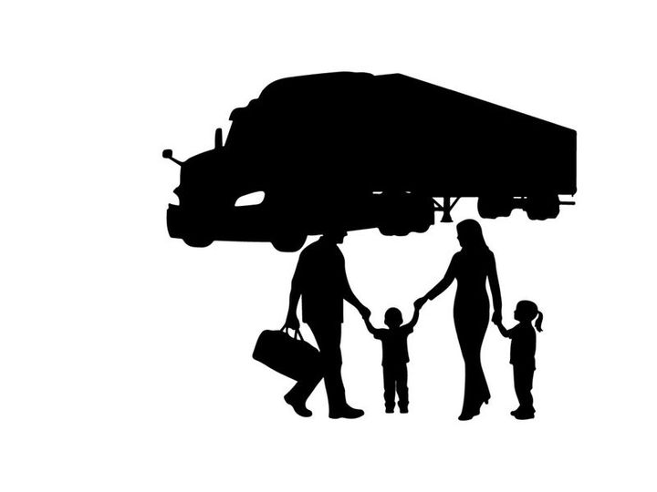 Family silhouette with parents and children under a moving truck silhouette