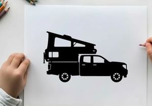 Silhouette of a pickup truck with a camper on the back
