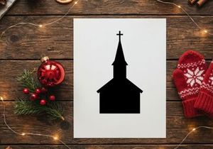 Silhouette of a church steeple with cross at sunset