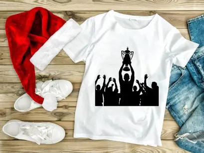 Silhouette of a triumphant team celebrating with a trophy