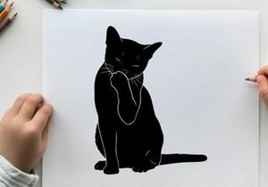 Silhouette of a black cat sitting and pawing at its face