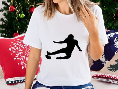 Rugby player kicking ball in mid action dynamic movement