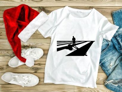 A man pulling a luggage on a striped surface with long shadows