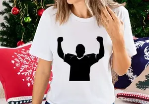 A person celebrating with arms raised in triumph and victory