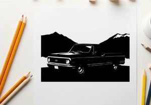 Silhouette of a classic pickup truck in front of mountains