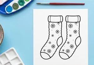 Pair of festive Christmas socks with snowflakes and ribbons for holiday celebrations