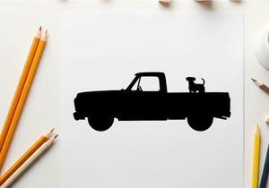 Silhouette of a pickup truck with dog in the back