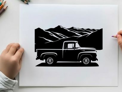 Vintage truck silhouette against majestic mountain range