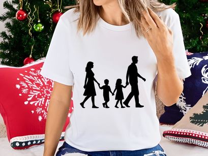 Happy family walking together holding hands silhouette outdoor