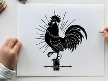 Silhouette of a rooster on a fence post silhouette