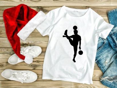 Silhouette of a person skillfully juggling three balls with one leg raised