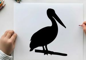 Silhouette of a pelican bird standing on a branch