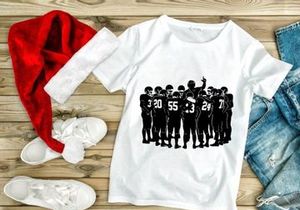 American football team huddle in black and white silhouette