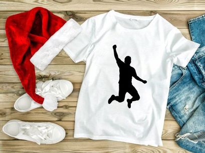 A silhouette of a person jumping in the air with one arm raised