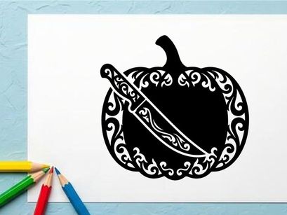 Silhouette of a pumpkin with a decorative carved design and a knife