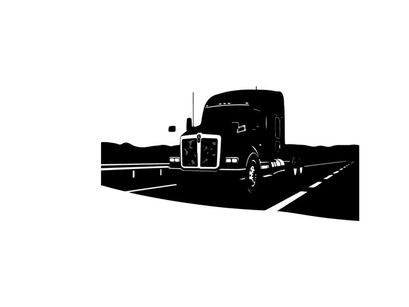Silhouette of a semi truck driving on a highway with mountains