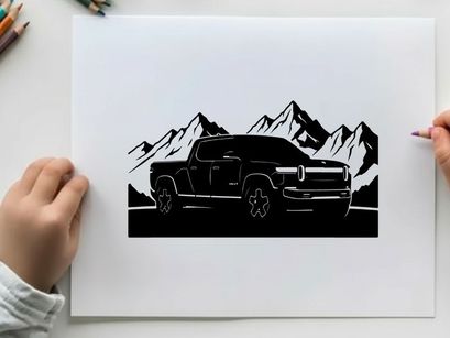 Silhouette of a pickup truck in front of majestic mountain range silhouette